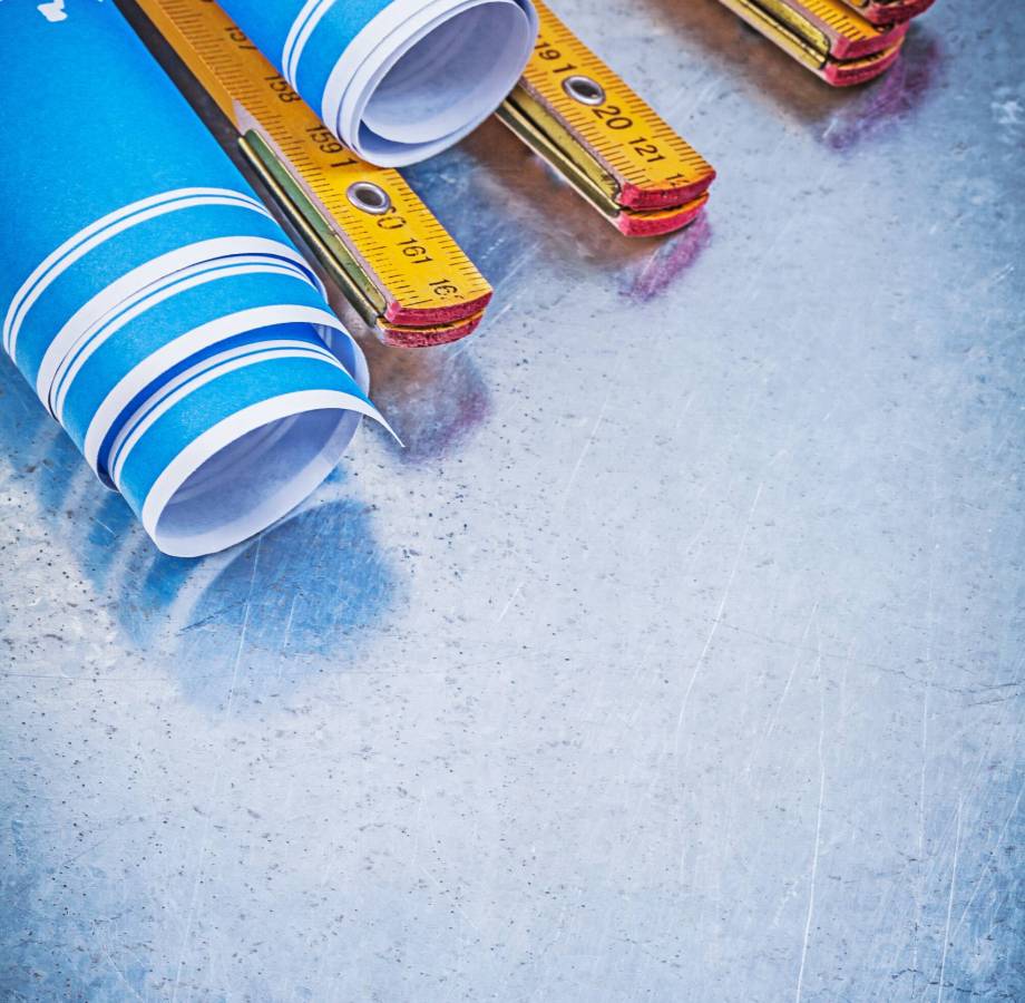 composition-of-blue-blueprints-wooden-meter-on-met-2026-01-11-09-31-40-utc