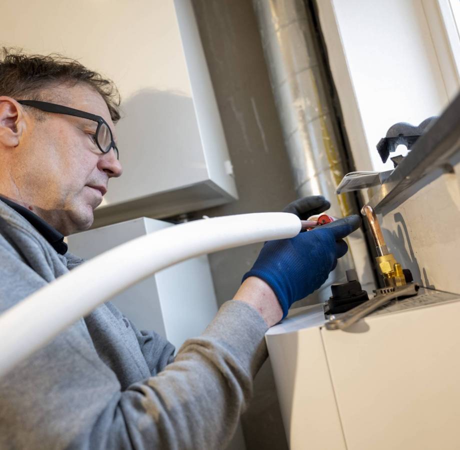 Man working on home plumbing system.